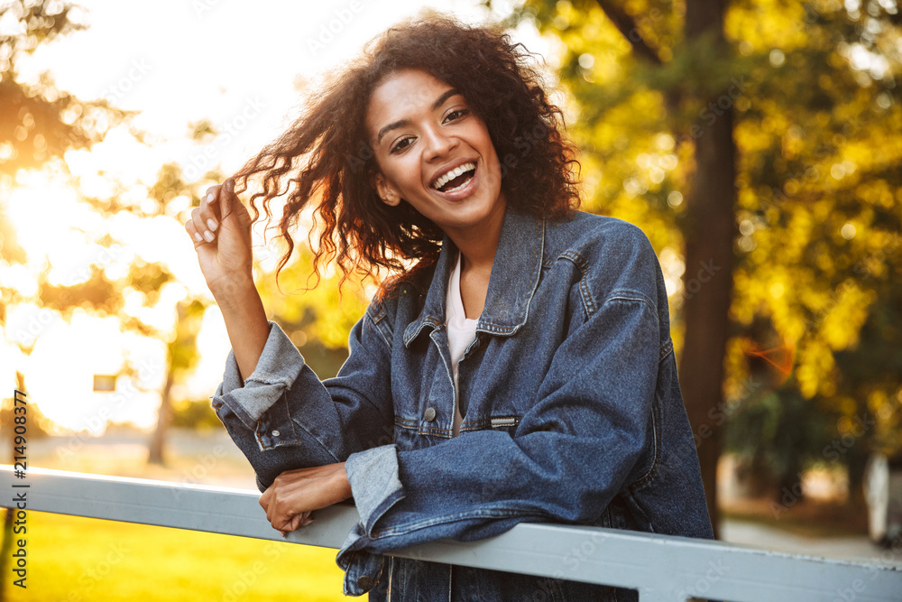 Poster happy young african girl in denim jacket