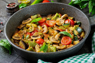 Hot spicy stew eggplant, sweet pepper, tomato, zucchini and mushrooms.