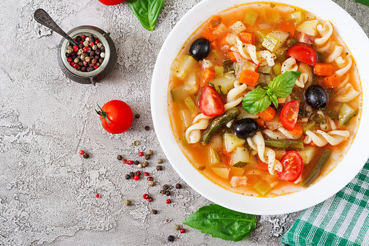 Minestrone, italian vegetable soup with pasta. Vegan food. Top view. Flat lay.