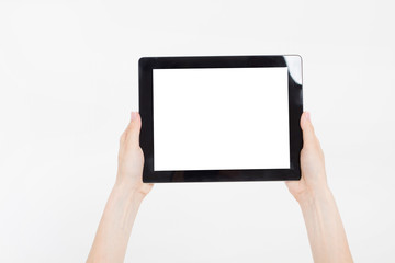 Hand holding black tablet isolated on white clipping path inside. Top view.Mock up.Copy...