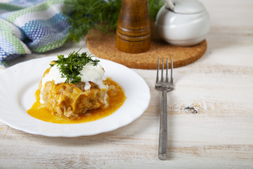 Lazy cabbage rolls on a wooden table.