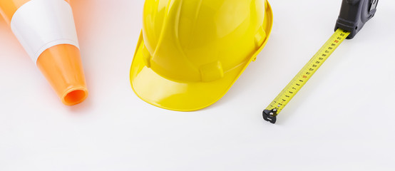 Traffic Cone, Hardhat, and Tape Measure on White Background Banner Image