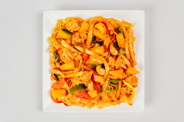 Fried noodles on a white plate