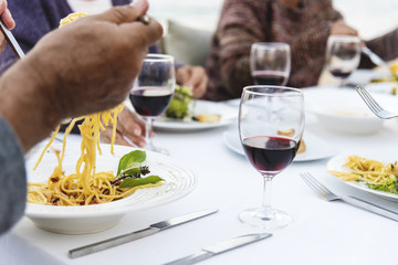 Seniors having a dinner party at the beach