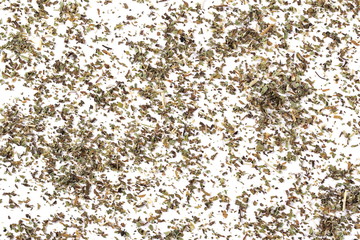 Pile of dried oregano leaves isolated on white background, top view