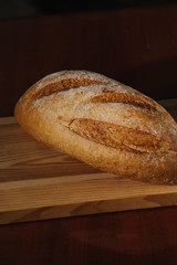 Healthy organic homemade bread on wooden table.