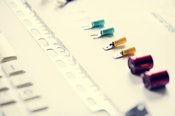 Closeup of various capacitors on white background