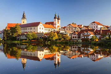  View of Telc across pond with reflections, southern Moravia, Czech Republic. © irakite