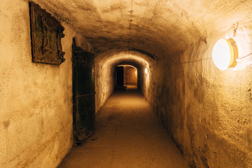Fototapeta premium Dark corridor of old underground Soviet military bunker under fortification., Sevastopol, Crimea