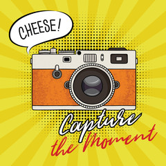 Vector illustration of a retro photo camera in a pop art style. Vintage photo camera icon. Capture the moment text.