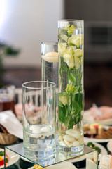 wedding decor. rose in glass of water