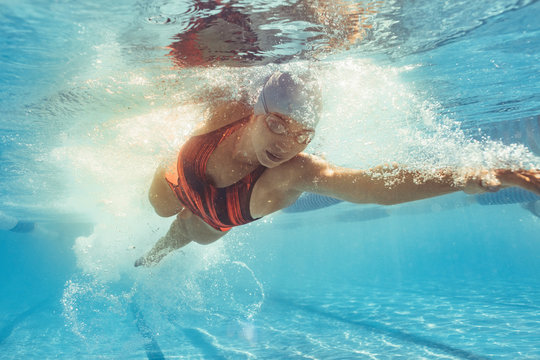 Fit female athlete during swim training