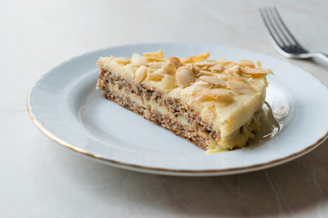 Slice of Swedish Almond Cake served with Plate.