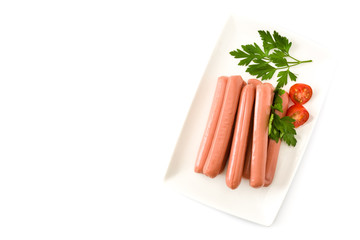 Raw sausages in a white plate isolated on white background. Top view. Copyspace