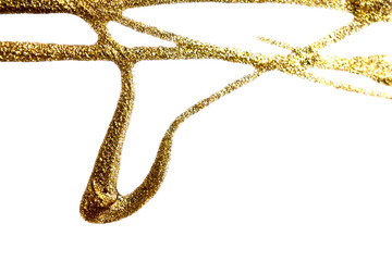 Flows of golden nail polish with glitter on white background. Rectangular photo.