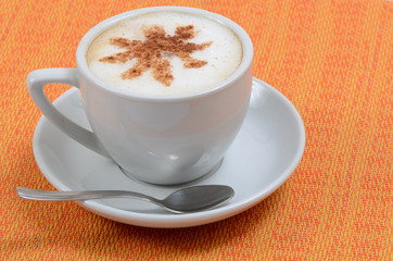 Cup of latte art on wood table