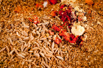 A mixture of spices in a glass jar shot close-up on a white background