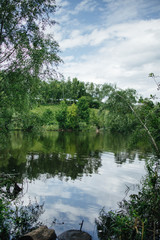 Amazing landscape of lake with clear green water and perfect blue sky. Nature and environment, ecology concept. Free clean climat. Non Water pollution
