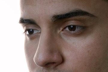 closeup of male eyes, isolated on white