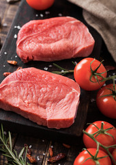 Fresh raw beef steak meat on wooden board