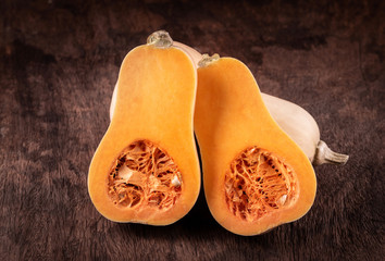 butternut squash over old wood background