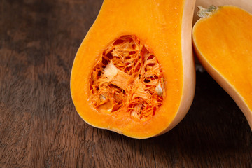 butternut squash over old wood background