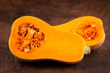 butternut squash over old wood background