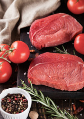 Fresh raw beef steak meat on wooden board