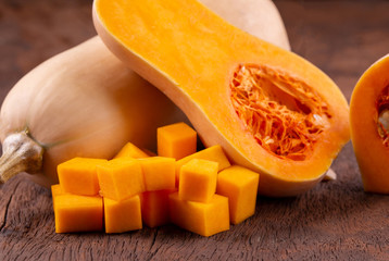 butternut squash over old wood background