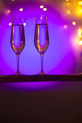 Champagne glasses in disco party bar