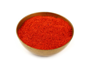 One bronze metal bowl full of red hot chili pepper