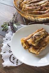 Delicious rolled, baked pancakes stuffed with sweet cheese. Salty meal.