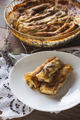 Delicious rolled, baked pancakes stuffed with sweet cheese. Salty meal.