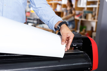 close-up vinyl paper in a large printer