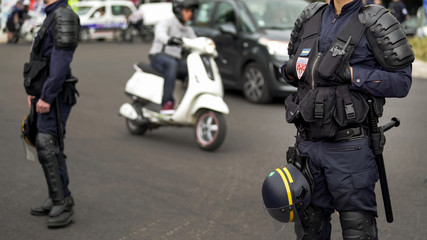 French policemen cordon off street, blocking traffic, threat of terrorist attack
