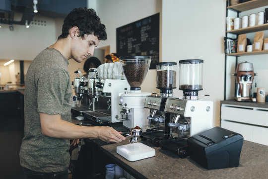 Barista preparing coffee in a coffee bar