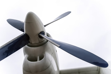 Fragment of screw aircraft isolated on white background. Engine with a propeller against the...