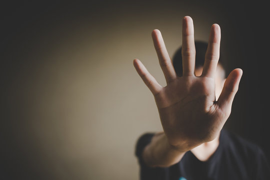 Stop, Child standing with outstretched hand showing stop, Violence concept.