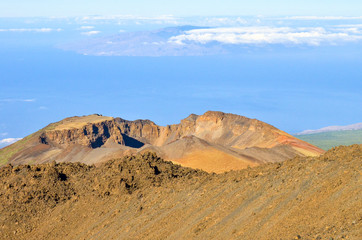 The view from the top of Teide volcano on Tenerife, Canary Islands to the Pico Viejo with surrounding clouds and the Atlantic Ocean.