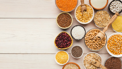 Cereals and legumes assortment on wooden table