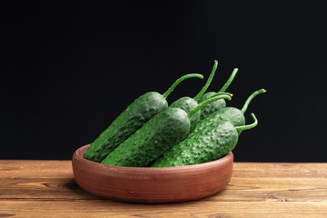 Cucumber on wooden background