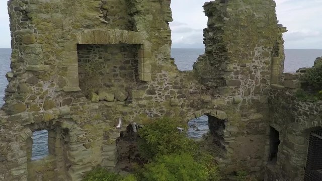 Stunning aerial shot crane up view of Dunure Castle, South Ayrshire, Scotland. Inside the walls.