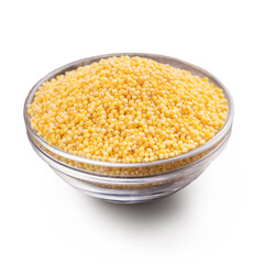 Fresh organic millet in bowl, Top view.