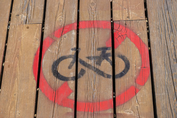 No bikes sign painted on a brawn wooden track