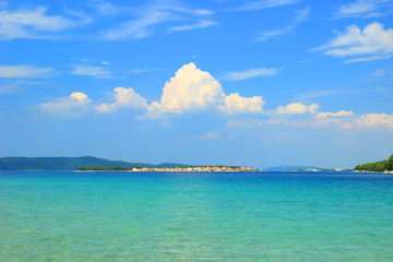Island Krapanj near Sibenik touristic destination, panoramic view, clear blue sea and sky with clouds
