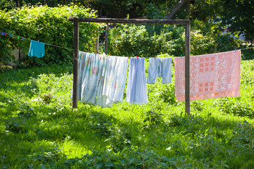 Lingerie dries on a rope outdoors in the village