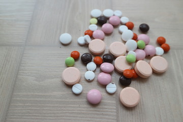 medical tablets and drugs of different shapes and colors for the treatment of diseases