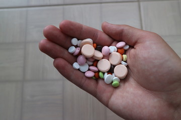 medical tablets and drugs of different shapes and colors for the treatment of diseases