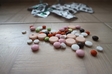 medical tablets and drugs of different shapes and colors for the treatment of diseases