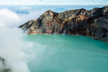 Fototapeta na wymiar View from Ijen Crater, Sulfur fume at Kawah Ijen, Vocalno in Indenesia